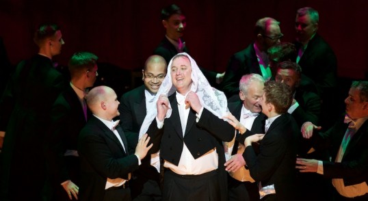 Craig MacBeth and male chorus. Photo Showcase Musical Productions